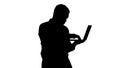 Silhouette Afro American business man working with laptop. Royalty Free Stock Photo