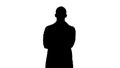 Silhouette Serious arabian doctor mature male with crossed arms.