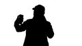 Silhouette Young adult man handsome taking selfie.