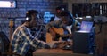 Young musicians playing in home studio Royalty Free Stock Photo