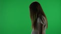 Medium side view green screen, chroma key shot of a posessed female figure, ghost, poltergeist, zombie standing still