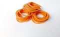 Medium size elastic rubber band in orange color for various purposes