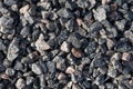 Medium-sized granite crushed stone. The stone is gray with a splash of pink and red. Material for the manufacture of building Royalty Free Stock Photo