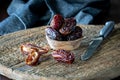 Medjool dates on a rustic wooden cutting board. Royalty Free Stock Photo