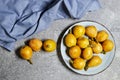 Medlar Fruit, Bunch of Loquats in plate. Group of Japanese Orange Frui