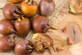 Medlars on an old wooden table Royalty Free Stock Photo