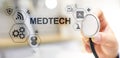 Medtech medical technology information integration internet big data concept on virtual screen. Doctor with stethoscope. Royalty Free Stock Photo