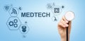 Medtech medical technology information integration internet big data concept on virtual screen. Doctor with stethoscope. Royalty Free Stock Photo