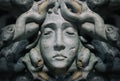Medusa goddess face bas-relief statue.