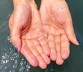 Medusa in the hands of a girl at the sea