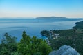 Medveja - A small metal cross on a rock with a panoramic view of the shore Royalty Free Stock Photo