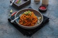 Mee goreng mamak, Indonesian and Malaysian cuisine, spicy fried noodles in a plate, copy space Royalty Free Stock Photo