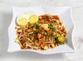 mee siam noodle soup or meesiam food with noodles, egg and chicken served in dish isolated on banana leaf top view of singapore Royalty Free Stock Photo