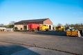 Meerhout, Antwerp Province, Belgium - The main court of a modern farm with barns and agriculture vehicles