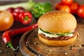 Meet and cheese burger at wooden desk Royalty Free Stock Photo