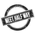 MEET HALF WAY text on black vintage stamp