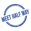 MEET HALF WAY text written on blue grungy round stamp