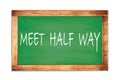 MEET HALF WAY text written on green school board