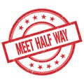 MEET HALF WAY text written on red vintage round stamp