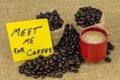 Meet me note coffee break meeting together beans burlap bag Royalty Free Stock Photo