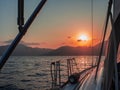 Meet the sunset in the Bay on Board the yacht, a romantic evening at sea. Boat trip on a yacht under sail.