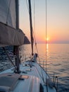 Meet the sunset in the Bay on Board the yacht, a romantic evening at sea. Boat trip on a yacht under sail.