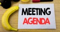 Meeting Agenda. Business concept for Business Schedule Plan written on sticky note empty paper, wooden background with copy space, Royalty Free Stock Photo