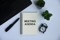 Meeting agenda text on notepad with office concept background. Business concept Royalty Free Stock Photo