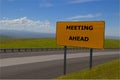 `Meeting Ahead` Yellow Road Sign Royalty Free Stock Photo