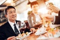 Meeting with chinese businessmen in restaurant. Men are eating sushi. Royalty Free Stock Photo