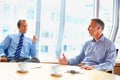 Meeting, conference room and business men in office for management conversation, talking and planning. Corporate workers Royalty Free Stock Photo