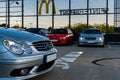 Meeting of fans of old cars at parking of shopping mall