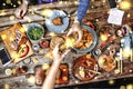 Meeting friends at the Christmas table. Traditional American sandwiches and bagels, beer and wine Royalty Free Stock Photo