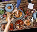 Meeting friends at the Christmas table. Traditional American sandwiches and bagels, beer and wine Royalty Free Stock Photo