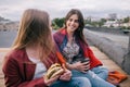 Meeting friends with takeaway junk food on roof