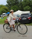 Meeting of Historical Bicycles - a lady in a vintage costume with corresponding bike