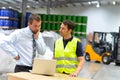 Meeting of the manager and worker in the warehouse - forklift an Royalty Free Stock Photo