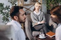 At a psychologist& x27;s appointment. Married couple, sad, depressed man and woman meeting with consultant to solve family Royalty Free Stock Photo