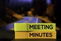 Meeting Minutes on the sticky notes with bokeh background