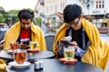 Meeting at outdoor cafe during cold weather