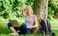 Meeting in park. summer online. girl runs her blog on notebook. modern woman with notebook blogging outdoor. girl