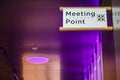 Meeting point sign at the tourist in a modern hall ,Meeting place for lost people or a safe point in an emergency Royalty Free Stock Photo