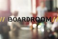 Meeting in progress. Closeup shot of a sign on a boardroom window with businesspeople blurred in the background. Royalty Free Stock Photo