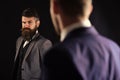 Meeting of reputable businessmen, black background. Man with beard on suspicious face, and shoulders of partner Royalty Free Stock Photo