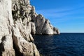 The meeting of rocks, sea and blue sky Royalty Free Stock Photo