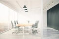 Meeting room with glass wall, blackboard, wooden table, window a