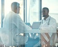 Meeting room, laptop and team of doctors for healthcare coworking, discussion and planning or teamwork. Working, talking Royalty Free Stock Photo