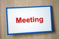 Meeting sign on the door of the conference room