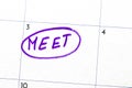 `meeting` sign written with a marker on the calendar Royalty Free Stock Photo