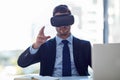 Meeting in virtual space. a businessman wearing a VR headset while working in his office. Royalty Free Stock Photo